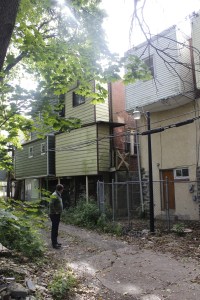 Abbie's son Michael, a builder and real-estate developer, inspecting the rear of what was once his grandparents' home on N. 52nd St.